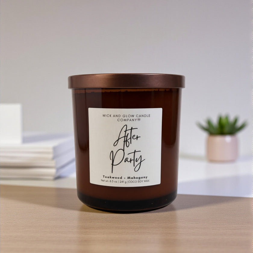 Brown candle with a label on a wooden surface, blurred background