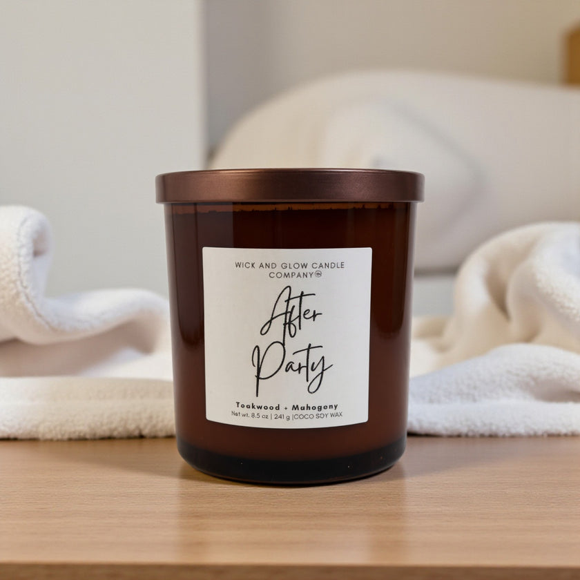 Candle with a label on a wooden surface, with a blurred background