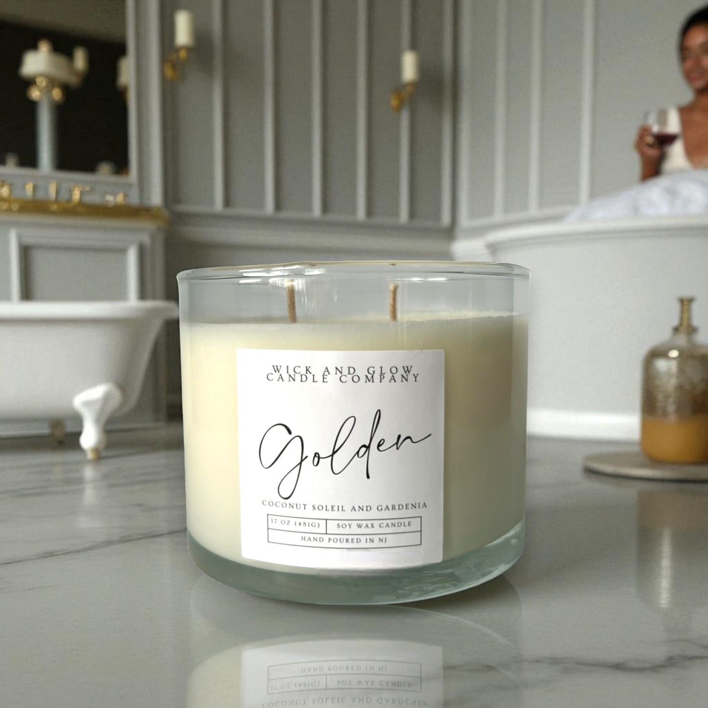 Candle with 'Wick and Glow' label in a bathroom setting