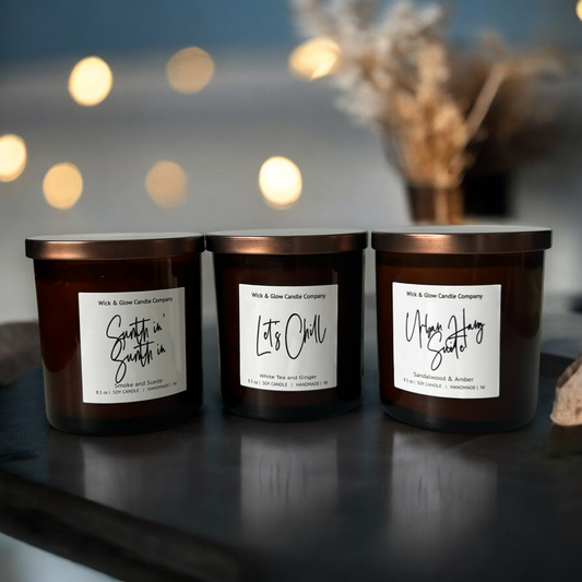 Set of luxury soy candles in amber glass jars with bronze lids, part of the Men of R&B collection