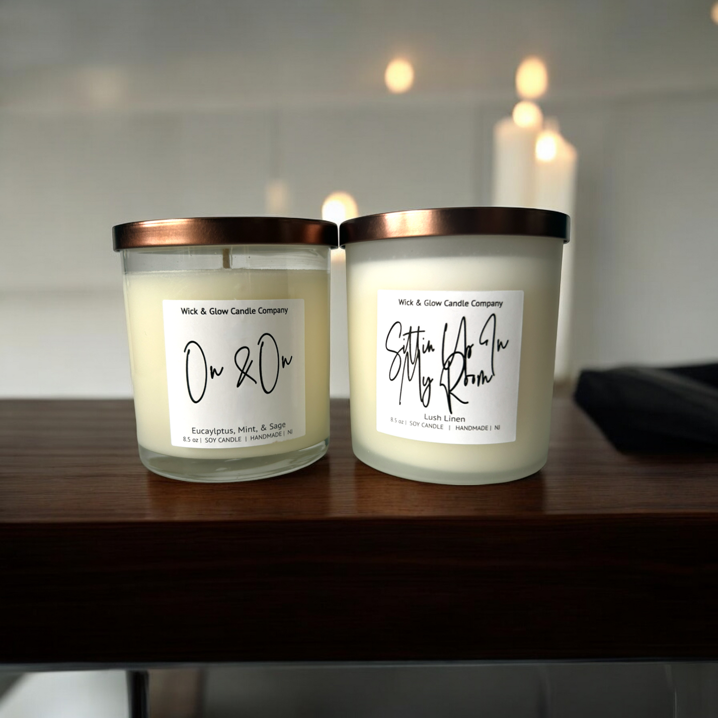 Pair of soy candles in frosted white glass jars with bronze lids, labeled 'Self Care Duo'