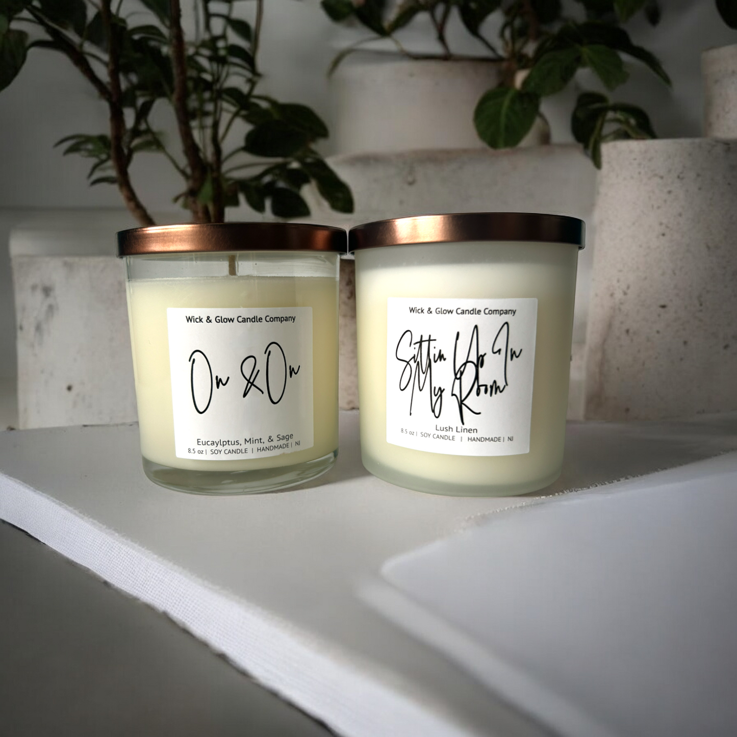 Two single wick and candle in a clear jar with a white label from Wick and Glow Candles.