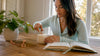 Woman trimming wick of non-toxic candle