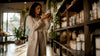 Woman reading candle ingredient label carefully