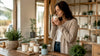 Woman sniff-testing soy wax candle at home
