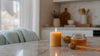 Burning beeswax candle in cozy home setting