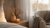 Candle and reed diffuser layering fragrance indoors