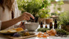 Hands mixing natural fragrance ingredients