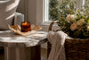 Luxury candle with note on wooden table