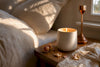 Flickering candle in warm bedroom corner