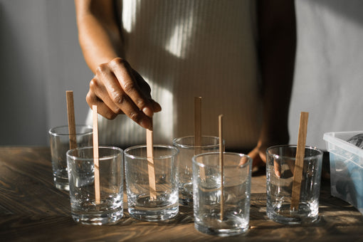 woman making candles