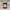 Candle with 'After Party' label on a wooden surface, blurred background