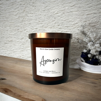 Wick and Glow luxury soy wax candle in an amber glass container with an aroma of  Juniper and Berry.