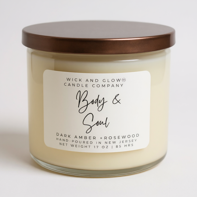 Clear large candle on a white background with a label that reads Body and Soul