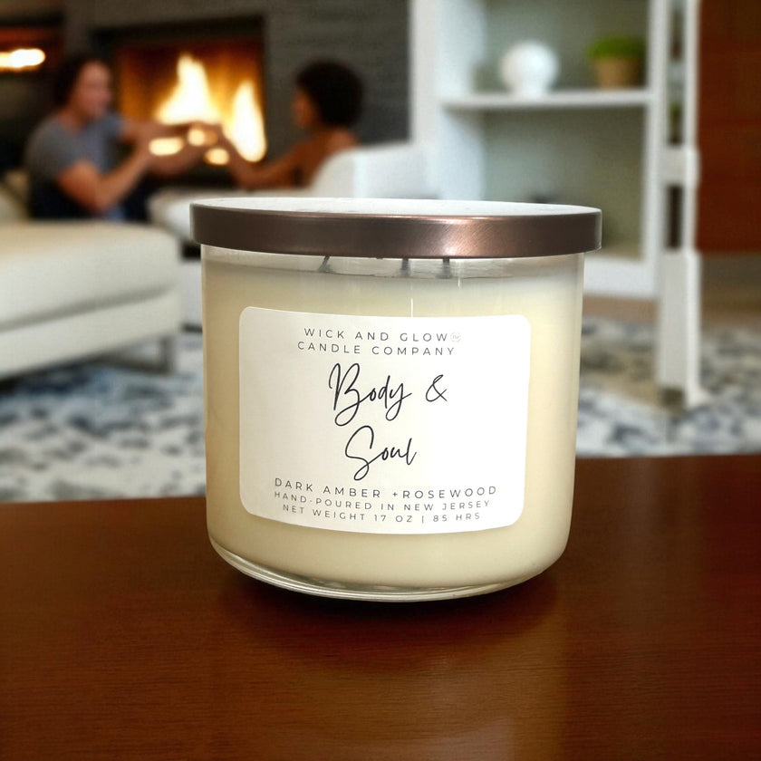 Candle with a label on a table in a cozy living room setting