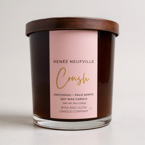 Candle with a pink label on a white background