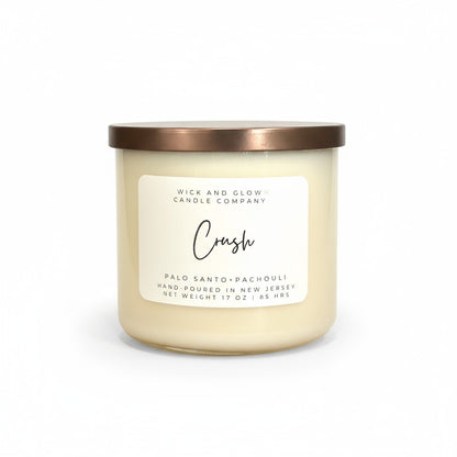 Palo Santo and Patchouli white candle with a bronze lid by Wick and Glow Candle Company