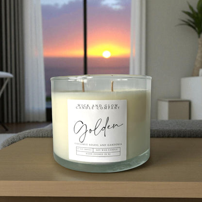 Candle with a label on a surface with a sunset view in the background