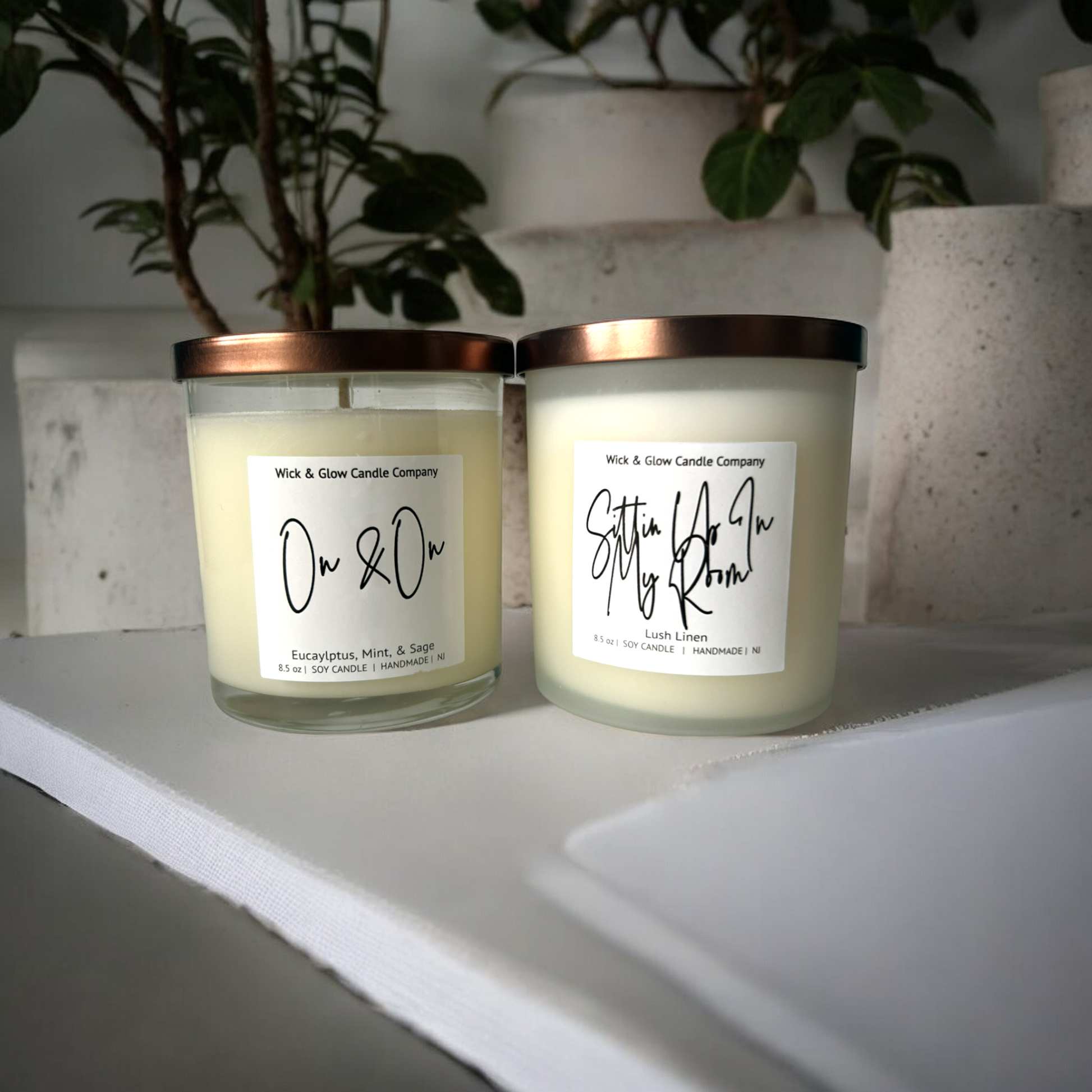 Two single wick and candle in a clear jar with a white label from Wick and Glow Candles. 