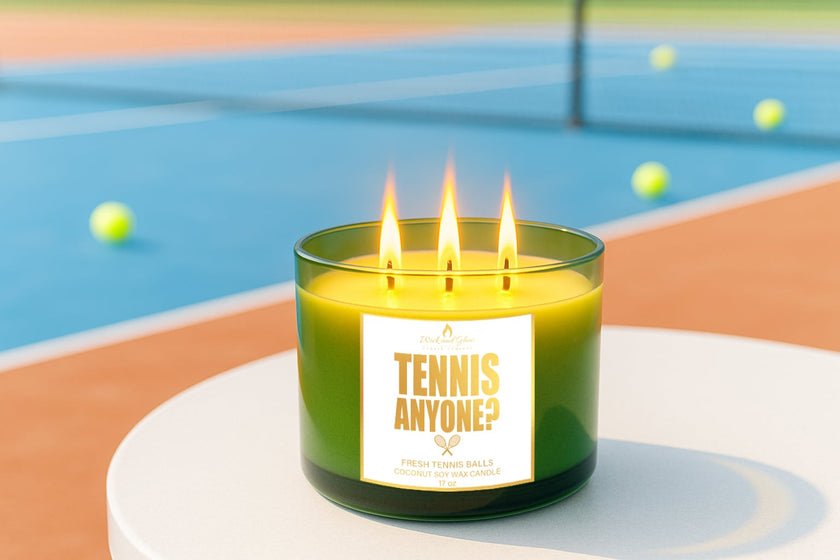Three-wick candle labeled 'Tennis Anyone?' on a tennis court